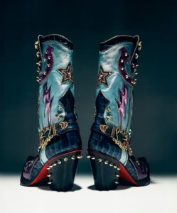 “Christian Louboutin Kennywood Alta Boots in black leather with a sleek over-the-knee design and iconic red soles