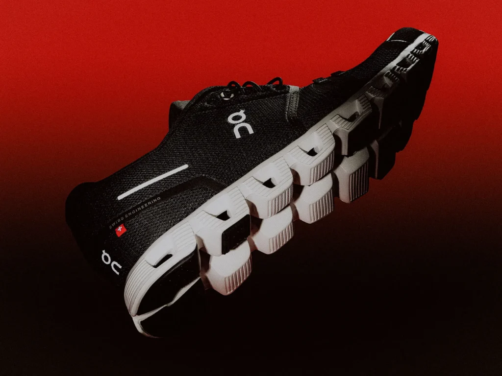 On running shoes with unique CloudTec soles, showcasing Swiss design and innovation in athletic footwear