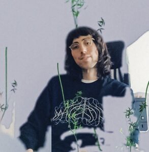 A.G. Cook and Charli XCX discussing the creative process behind the Brat album, set against a studio backdrop