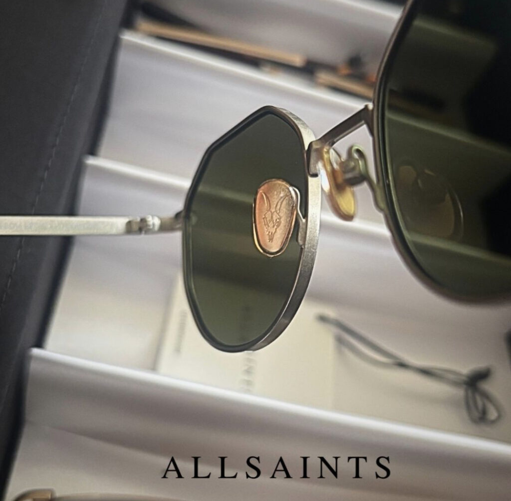 AllSaints ramskull design subtly embroidered on a sleek leather jacket, embodying strength, rebellion, and modern style