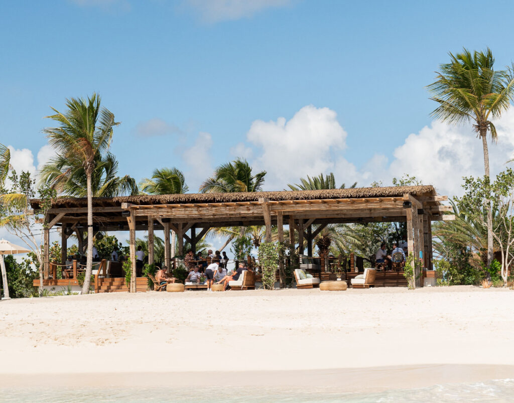 The Nobu Beach Inn in Barbuda, co-owned by Robert De Niro, offers luxury bungalows, villas, and eco-conscious exclusivity