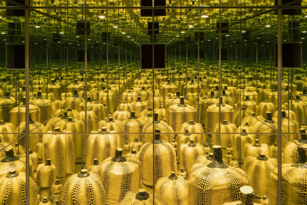Yayoi Kusama’s Mirror Room (Pumpkin), featuring polka-dotted pumpkins reflected infinitely in mirrored walls