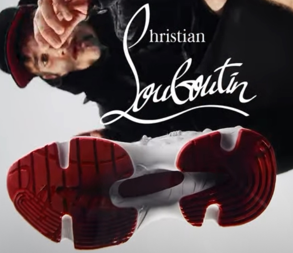 A stylish pair of Christian Louboutin Train Run sneakers showcasing bold design, premium materials, and signature red soles
