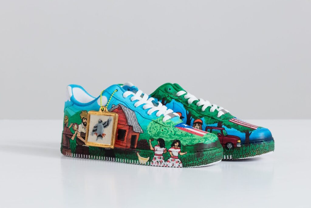 A display of Roberto Lugo’s hand-painted Nike Air Force 1 sneakers and ceramic teapots, blending art and street culture