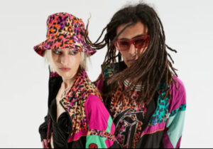 Models showcasing the Just Cavalli Fall 2025 collection, featuring bold prints, streetwear elements, and glamorous details