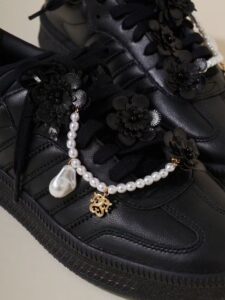 SNIDEL x Adidas Samba XLG sneakers in black and white, featuring chunky soles and elegant removable charms
