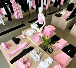 Alo Yoga Sweet Pink collection featuring stylish activewear pieces, including leggings, sports bras, and hoodies