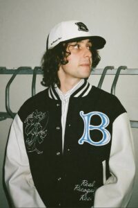 A selection of BoTT x New Era caps and beanies featuring bold embroidery and vibrant color options for streetwear enthusiasts