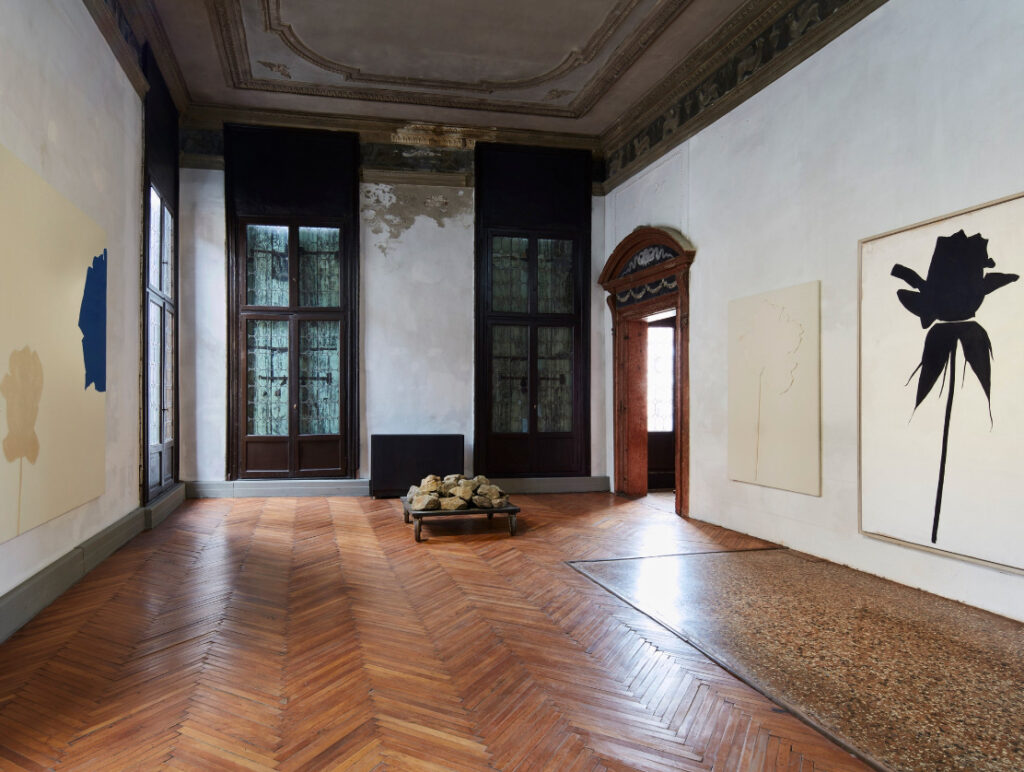 An exhibition space displaying detailed storyboards and sketches from legendary filmmakers at Prada Foundation Milan