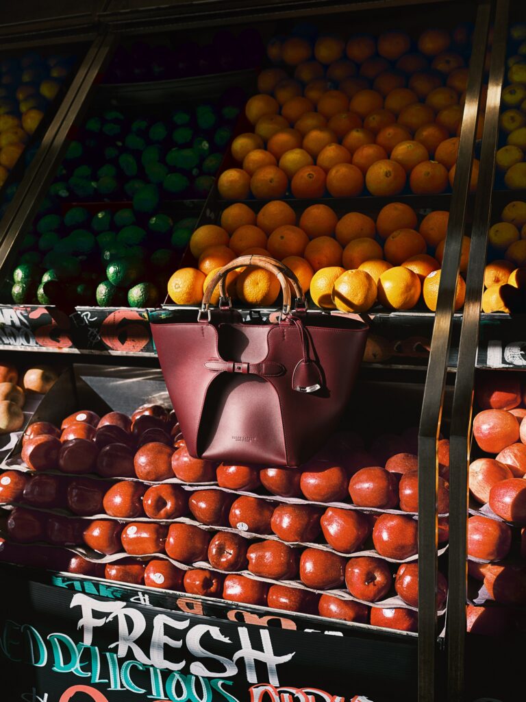 The Ralph Lauren Ralph Tote featuring calfskin leather, burl wood, and metal handle inspired by classic car design