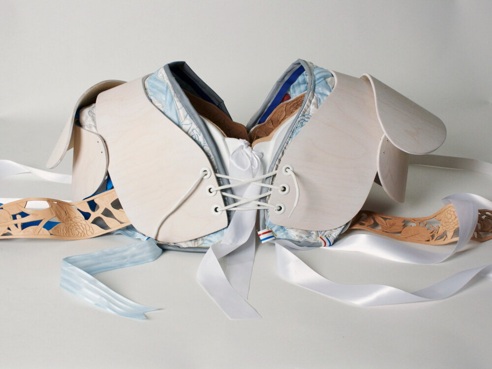 A sculptural artwork by Betsy Odom, Bulldog 30 Shoulder Pads, featuring leather, plywood, and intricate detailing