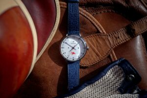 The limited-edition Autodromo Monoposto watch featuring Mobil 1’s red Pegasus logo, blending vintage racing and modern design
