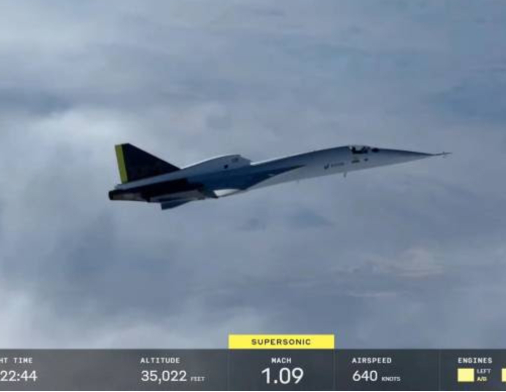 Boom Supersonic XB-1 aircraft in flight over the Mojave Desert, achieving supersonic speed as part of a key test mission
