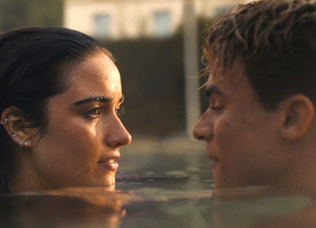 A cinematic still from My Fault, featuring Noah and Nick in an intense moment, reflecting the film’s forbidden romance theme