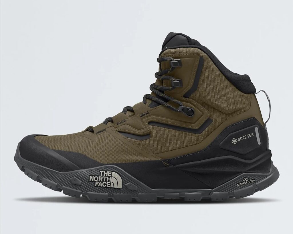 The North Face GORE-TEX jacket worn by a hiker in the rain, showcasing waterproof and breathable protection