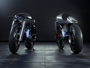 Porsche Café Racer concept motorcycle with aerodynamic teardrop design, silver finish, and Carrera-inspired styling