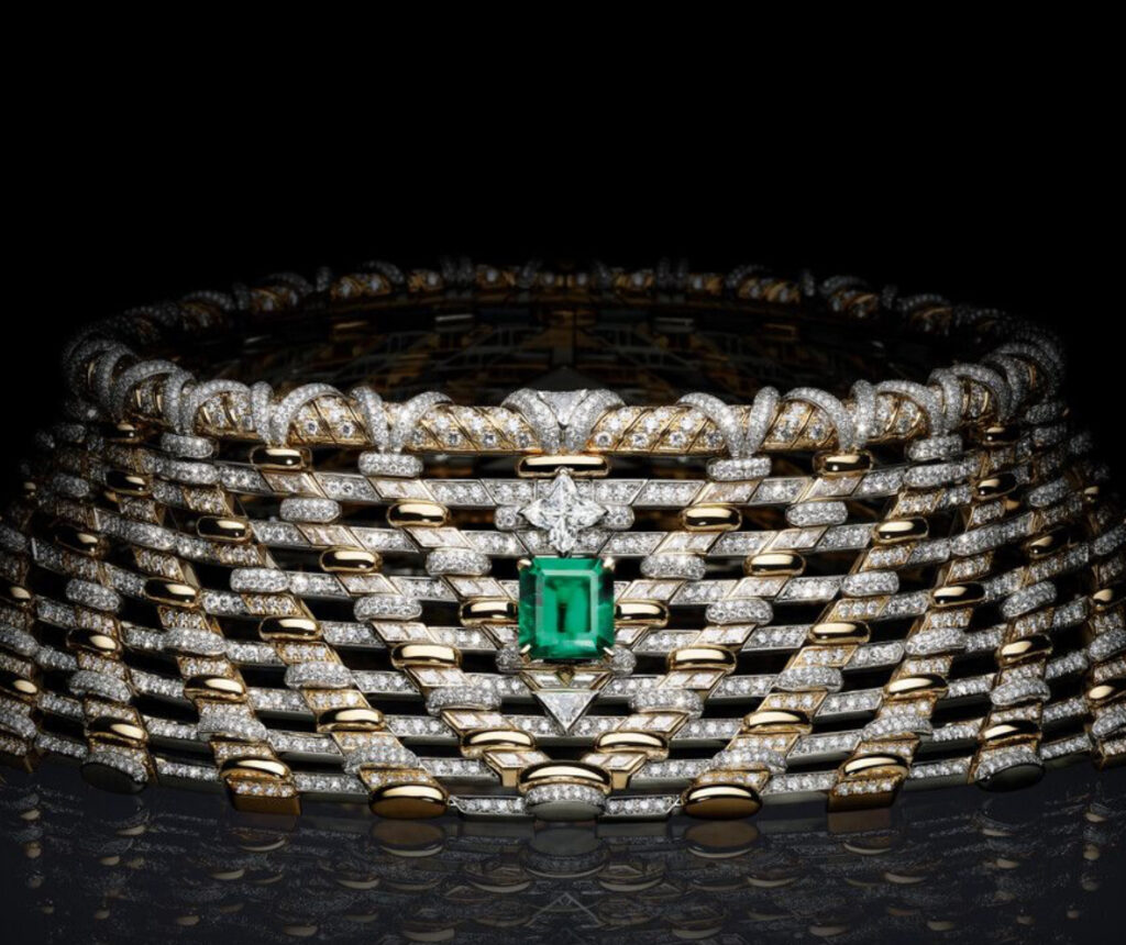 A dazzling high jewelry piece from the Awakened Hands, Awakened Minds Collection, featuring diamonds, sapphires, and emeralds