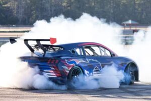 Ford’s Mustang Mach-E NASCAR Prototype, a high-performance EV race car, showcases cutting-edge electric racing technology