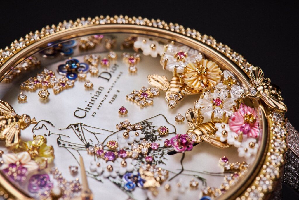 Intricately crafted luxury watch featuring guilloché patterns, enamel detailing, and artistic miniature painting on the dial