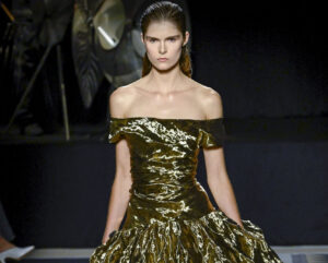 Peter Copping presenting his debut collection at Lanvin, featuring elegant designs inspired by Jeanne Lanvin’s legacy