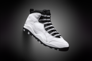 A close-up of the Air Jordan 10 ‘Steel’ 2025 edition, showcasing its sleek white leather upper and signature black accents