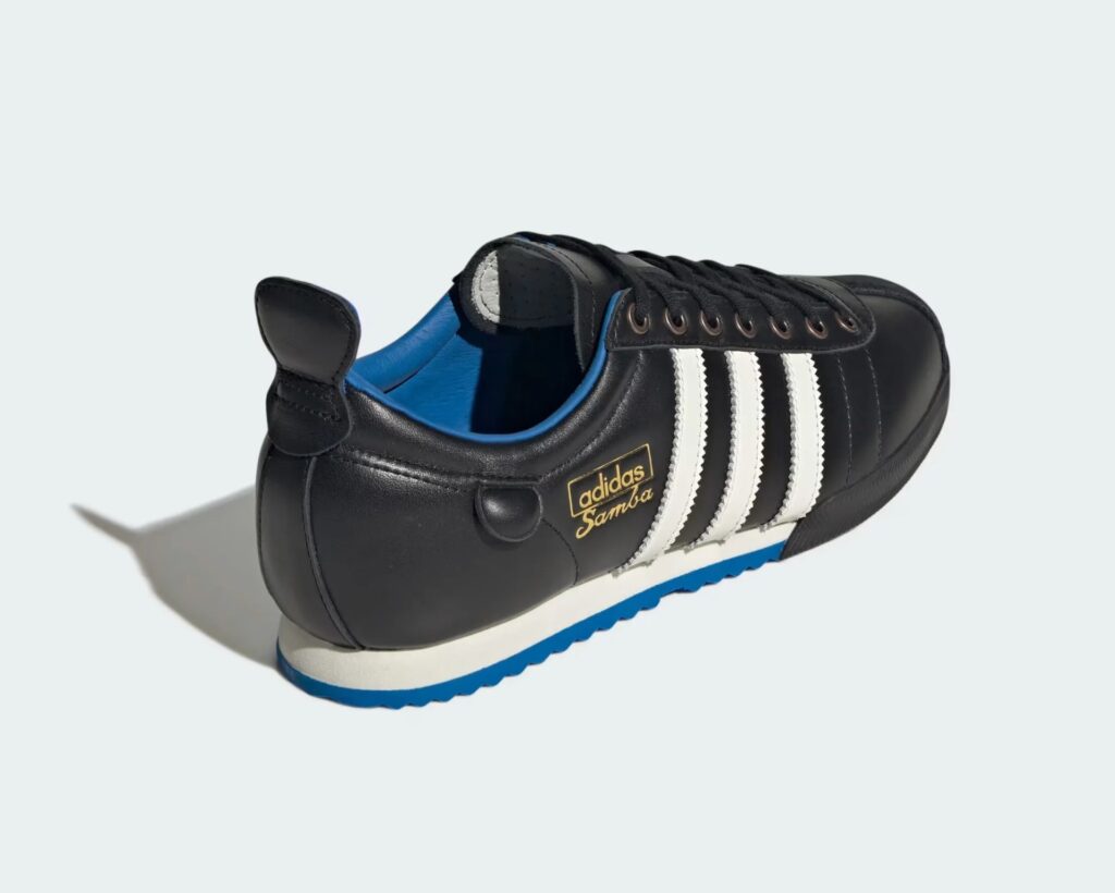 Close-up of the Adidas Samba 62 sneaker, featuring a black leather upper, gum outsole, gold-foil branding, and vintage details