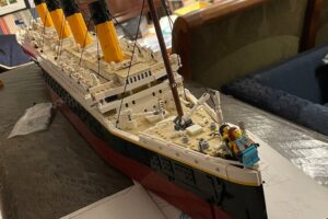 A showcase of rare LEGO sets, including vintage and exclusive editions, neatly arranged on display shelves