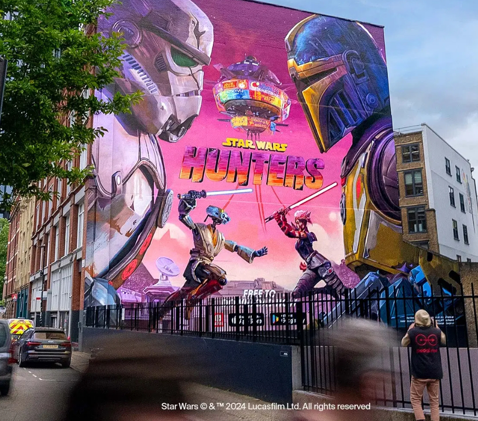 A massive, vibrant mural of Star Wars: Hunters characters in London, celebrating the game’s Galactic Unveiling