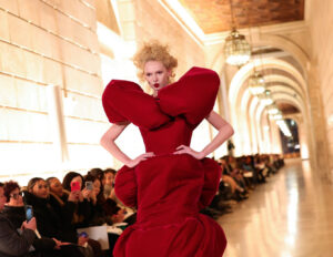 Marc Jacobs Spring 2025 show featuring models in oversized, theatrical silhouettes at the New York Public Library
