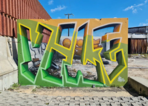 A mesmerizing 3D graffiti mural on a city wall, creating a realistic optical illusion of depth and movement