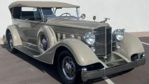 Fully restored 1934 Packard Super 8 with Goddess of Speed hood ornament, showcasing vintage luxury and classic elegance