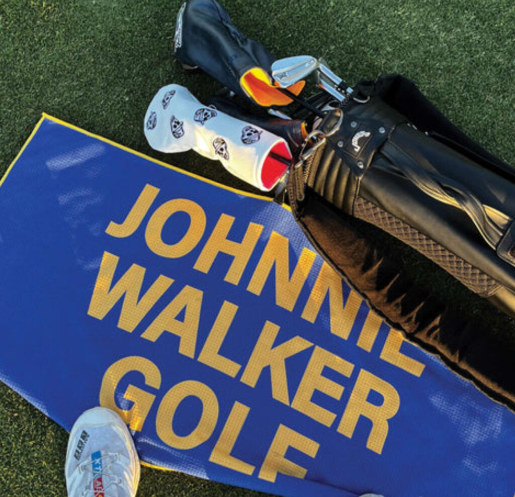 Johnnie Walker x Devereux Golf Keep Walking Collection featuring tartan-inspired apparel and accessories at the 2025 WM Phoenix Open