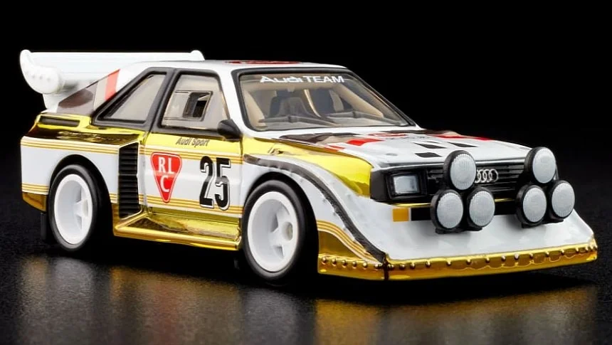 Hot Wheels 1985 Audi Sport quattro S1 die-cast model in yellow, featuring iconic rally details and an opening hood