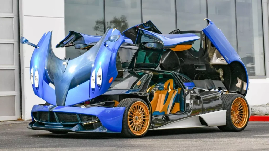 The Pagani Huayra Oceano Pacifico, a one-off hypercar with a deep blue exterior, white accents, and exposed carbon fiber