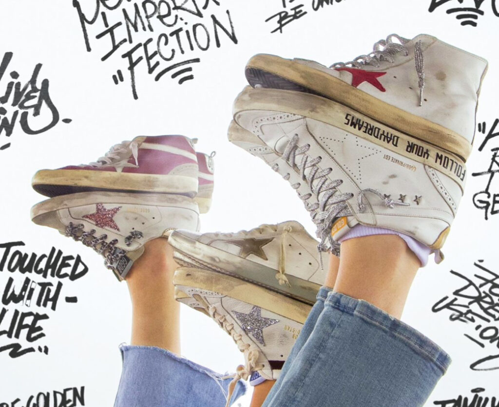 Golden Goose luxury shoes displayed in a boutique, symbolizing the brand’s growth and €2.2B valuation after new investment