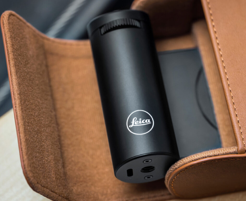 The Leica LUX Grip enhances iPhone photography with a two-stage shutter release, customizable controls, and MagSafe attachment