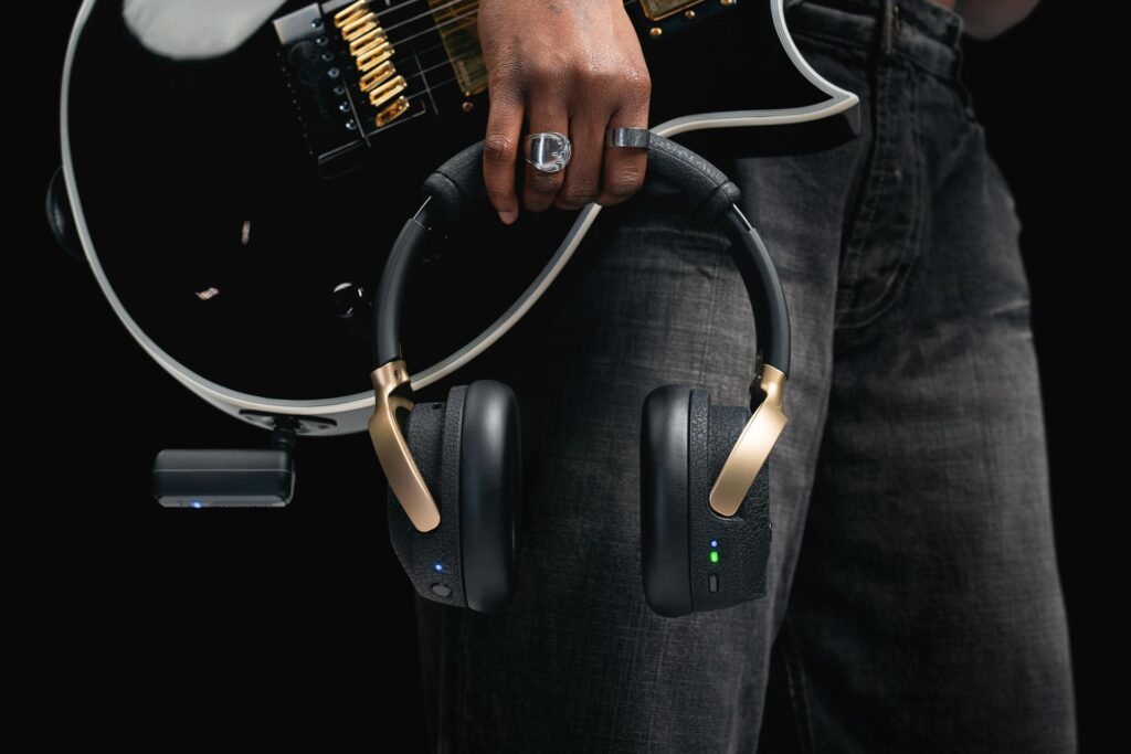 Positive Grid Spark Neo wireless headphones with built-in AI-powered guitar amp technology, offering over 100,000 tones