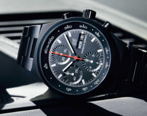 Porsche Design Chronograph 1, an all-black racing chronograph with precision engineering and a sleek, minimalist aesthetic
