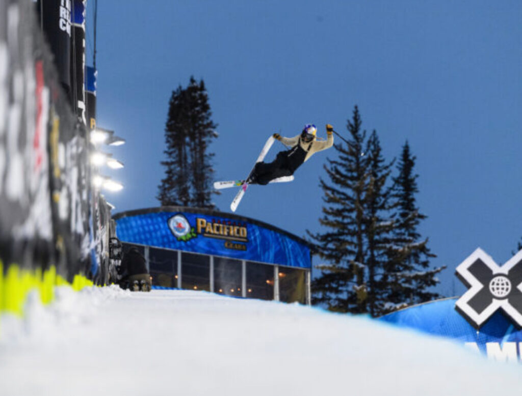 Snowboarder mid-air performing a trick at Winter X Games 2025, showcasing extreme winter sports action in Aspen, Colorado Snowboarder mid-air performing a trick at Winter X Games 2025, showcasing extreme winter sports action in Aspen, Colorado