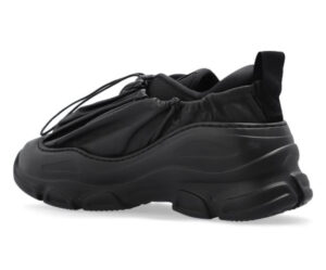 A pair of Vivienne Westwood x ASICS shoes, showcasing bold design, innovative materials, and high-fashion aesthetics