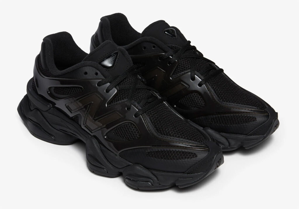 A sleek, all-black New Balance 9060 Black Cat shoe with premium suede and mesh, designed for style and comfort