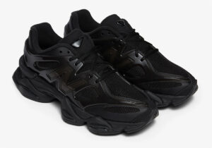 A sleek, all-black New Balance 9060 Black Cat shoe with premium suede and mesh, designed for style and comfort