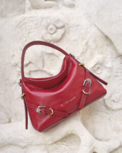 A Givenchy Nano Voyou bag in premium leather, featuring a sleek silhouette, engraved metal details, and a removable strap