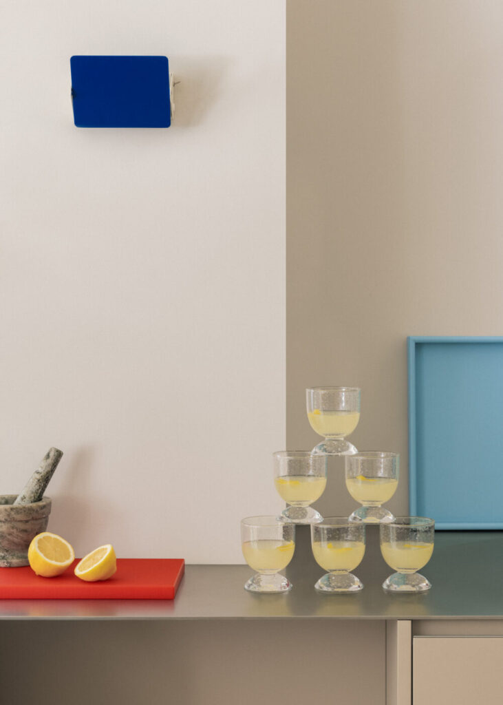 Chilled petite sour cocktails in small glasses, perfect for greeting guests at a party or event