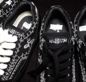 A close-up of the limited-edition Converse sneaker designed by fashion maestro Shinya Kozuka, highlighting its unique aesthetic blend of muted and bold elements