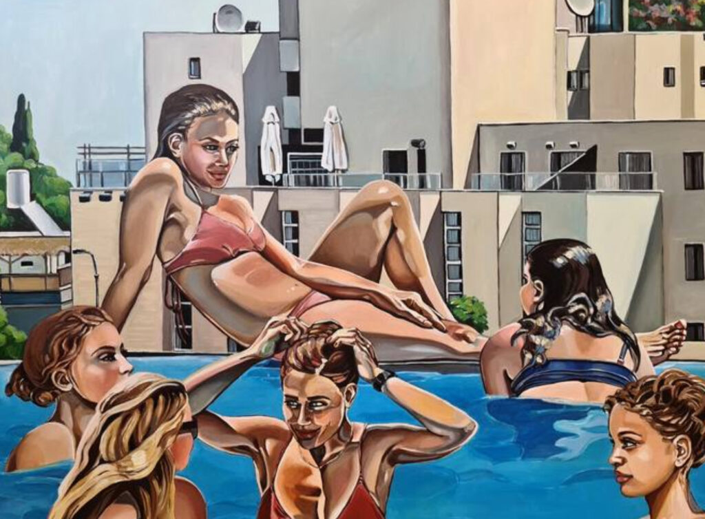 Colorful swimwear and accessories inspired by Noemi Safir's art, displayed at a poolside event under sunny skies