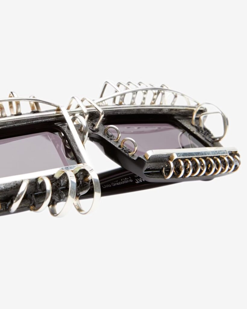 Junya Watanabe x Kuboraum's limited edition sunglasses, showcasing their unique charred finish and handcrafted design inspired by punk rock