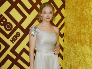 A radiant Amanda Seyfried on the red carpet, reflecting her versatile and accomplished acting career