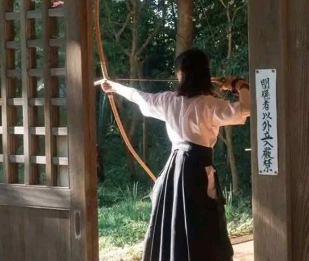 An archer performing Kyudo, demonstrating the graceful and meditative nature of the traditional Japanese martial art