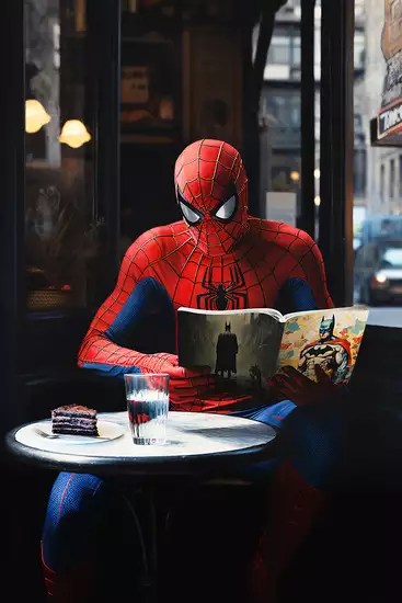 "Work Break" by Tom Baker, showcasing Spider-Man enjoying a quiet moment with coffee, commenting on modern work culture and superheroes' humanity